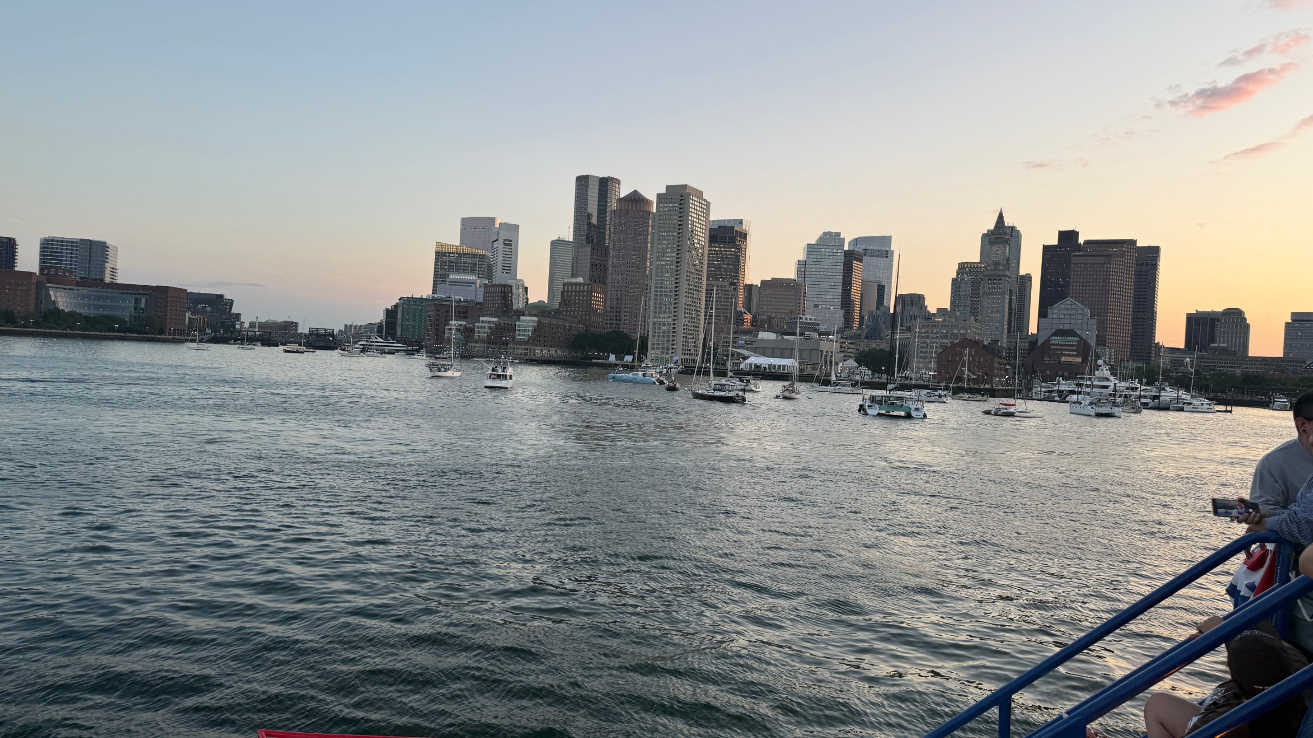 The Boston skyline across the harbor at sunset