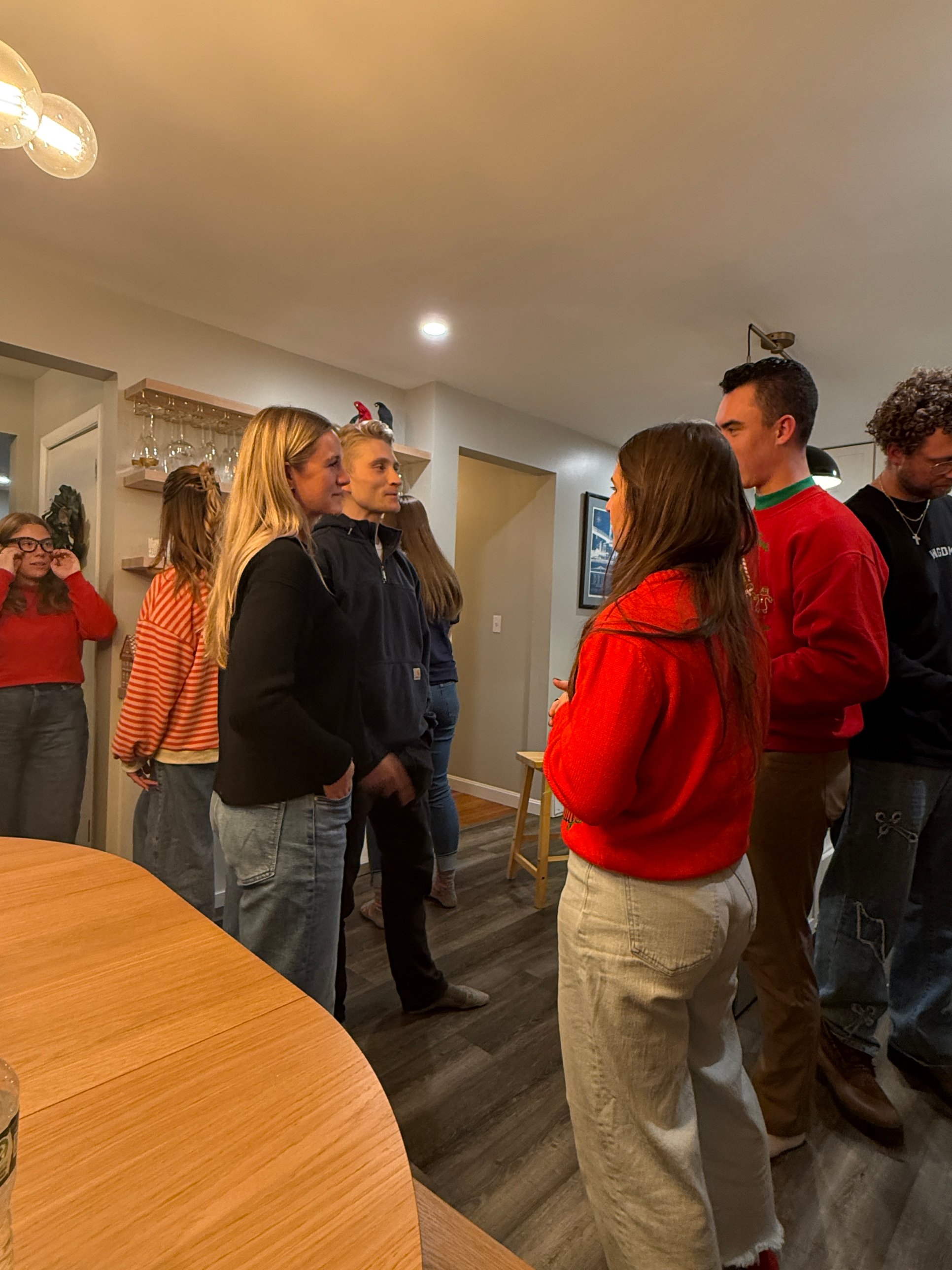 Grace Hill friends talking together at a gathering in a home