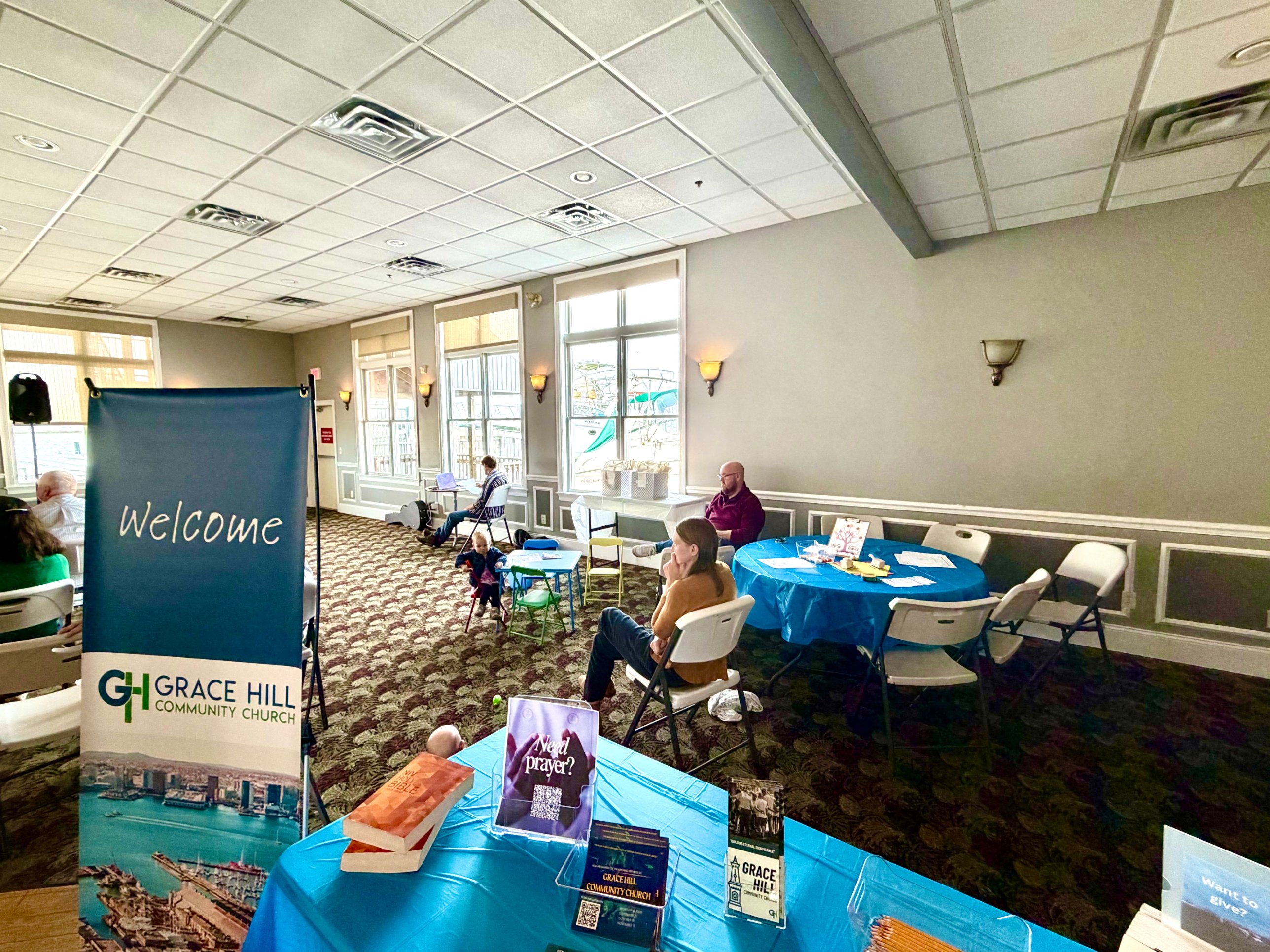 The welcome table and kids area at Grace Hill